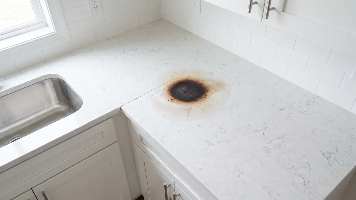 Example: the same counter after cleaning; the scorched patch and crack are still there